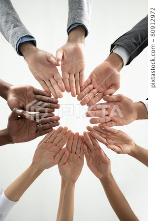 Close up of diverse people join hands in circle Close up of diverse people join hands in circle 80912972