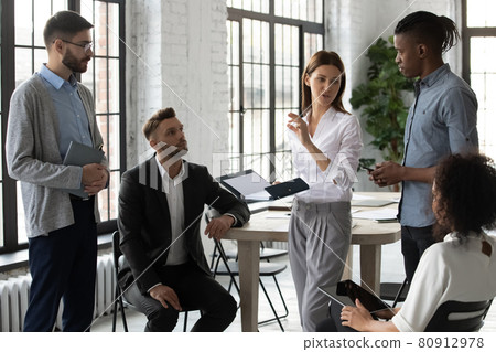 Young diverse businesspeople engaged in team thinking in office Young diverse businesspeople engaged in team thinking in office 80912978