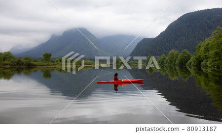 Adventure Caucasian Adult Woman Kayaking in Red Kayak Adventure Caucasian Adult Woman Kayaking in Red Kayak 80913187