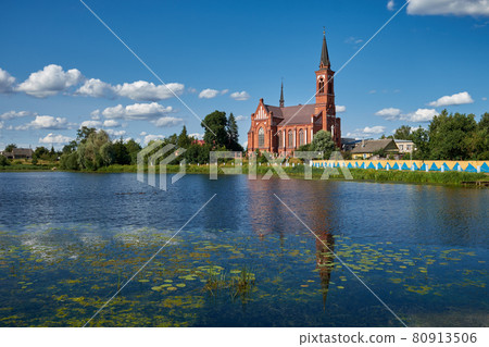 Old ancient church of St Anthony of Padua by river in Postavy, Vitebsk region, Belarus. 80913506
