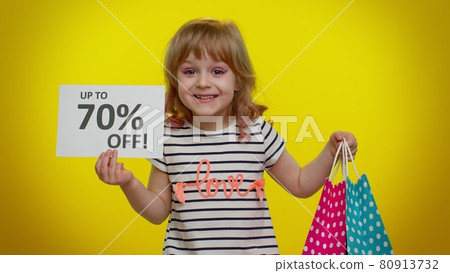 Kid child girl showing shopping bags and Up To 70 Percent Off inscriptions banner text, Black Friday Kid child girl showing shopping bags and Up To 70 Percent Off inscriptions banner text, Black Friday 80913732