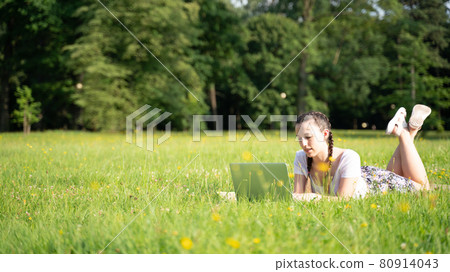 Business outside. Student girl work with laptop, computer tablet in summer park. Online technology with woman outdoor. Escaped of office distance education concept. 80914043
