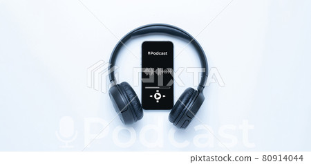 Podcast music. Mobile smartphone screen with podcast application, sound headphones. Audio voice with radio microphone on white background. Broadcast media music banner with copy space. 80914044