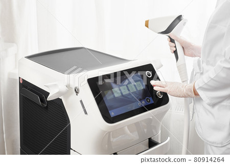 Modern equipment for laser hair removal and hair removal in a beauty salon. Beauty salon and cosmetology Modern equipment for laser hair removal and hair removal in a beauty salon. Beauty salon and cosmetology 80914264