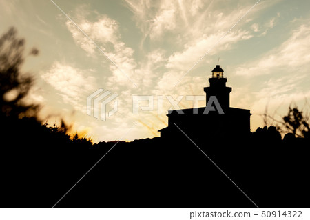 Silhouette view of lighthouse in Capo Testa at sunset - Sardinia 80914322