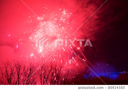 NIAGARA FALLS, ONTARIO, CANADA - MAY 20th 2018: Niagara Falls lit at night by colorful lights with fireworks NIAGARA FALLS, ONTARIO, CANADA - MAY 20th 2018: Niagara Falls lit at night by colorful lights with fireworks 80914385
