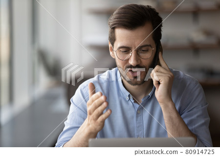 Engaged millennial employee, consultant, advisor, manager working at laptop 80914725