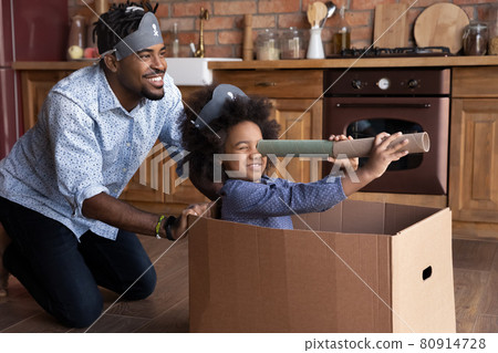 Happy ethnic dad and daughter play pirates together Happy ethnic dad and daughter play pirates together 80914728