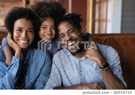 Portrait of happy ethnic family relax with daughter Portrait of happy ethnic family relax with daughter 80914734