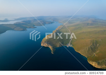 A ferry from the east coast to Olkhon Island Khuzhir at sunrise. Lake Baikal. From the side of the island. A ferry from the east coast to Olkhon Island Khuzhir at sunrise. Lake Baikal. From the side of the island. 80914789