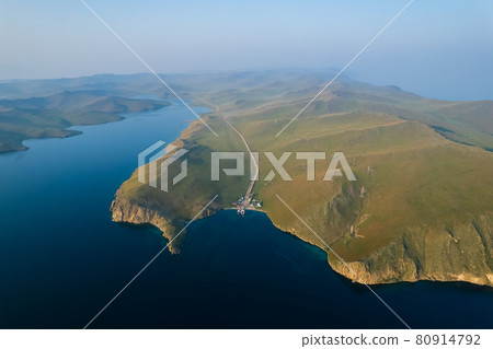 A ferry from the east coast to Olkhon Island Khuzhir at sunrise. Lake Baikal. From the side of the island. A ferry from the east coast to Olkhon Island Khuzhir at sunrise. Lake Baikal. From the side of the island. 80914792