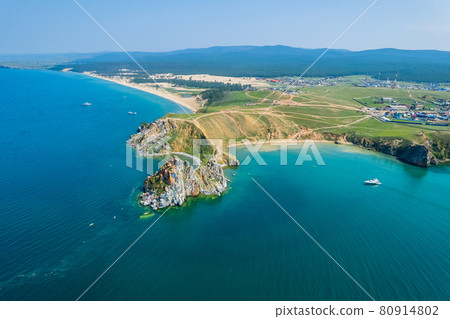 Olkhon Island, the largest island in Lake Baikal in eastern Siberia. Shamanka Rock on Baikal lake near Khuzhir at Olkhon island in Siberia, Russia. 80914802
