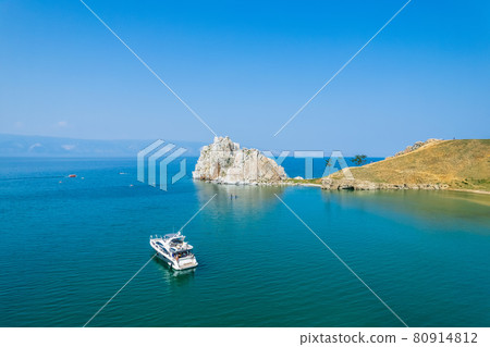 Olkhon Island, the largest island in Lake Baikal in eastern Siberia. Shamanka Rock on Baikal lake near Khuzhir at Olkhon island in Siberia, Russia. 80914812