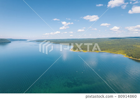 The Angara River is a major river in Siberia leaving Lake Baikal near the settlement of Listvyanka. Panoramic aerial view. 80914860