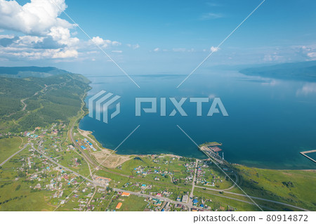 Summertime imagery of Lake Baikal is a rift lake located in southern Siberia, Russia Baikal lake summer landscape view from a cliff near Grandma's Bay. Drone's Eye View. 80914872
