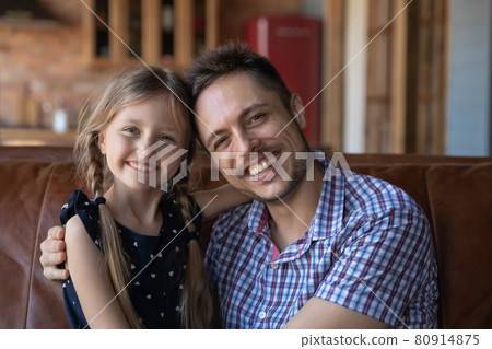Head shot family portrait of happy dad hugging little daughter Head shot family portrait of happy dad hugging little daughter 80914875