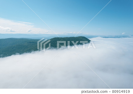 Flying through the clouds above mountain tops. High peaks wonderful morning sunrise natural Landscape Flying through the clouds above mountain tops. High peaks wonderful morning sunrise natural Landscape 80914919