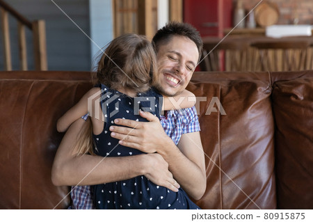Happy young father hugging little preschooler daughter girl with love 80915875