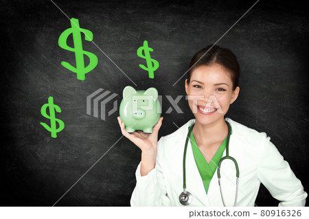 Health insurance cost healthcare professional Asian doctor woman showing green piggy bank money savings on blackboard background Health insurance cost healthcare professional Asian doctor woman showing green piggy bank money savings on blackboard background 80916326