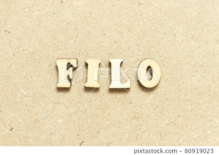 Alphabet letter in word FILO (abbreviation of first in last out) on wood background Alphabet letter in word FILO (abbreviation of first in last out) on wood background 80919023