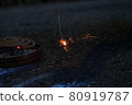 Summer night fun: sparks of sparklers 80919787