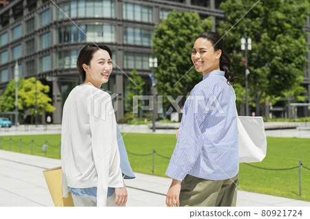 A woman walking in the city A woman walking in the city 80921724