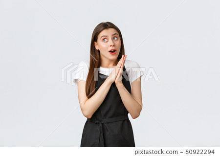 Grocery store employees, small business and coffee shops concept. Excited dreamy female cafe worker having interesting idea for new summer menu, rubbing hands and looking left intrigued Grocery store employees, small business and coffee shops concept. Excited dreamy female cafe worker having interesting idea for new summer menu, rubbing hands and looking left intrigued 80922294