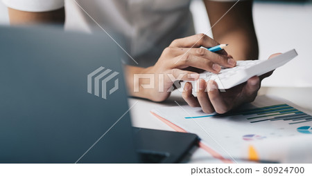 Close up hand of accounting man working on workplace desk in office use calculator calculates monthly expenses, taxes, check bank account balance Close up hand of accounting man working on workplace desk in office use calculator calculates monthly expenses, taxes, check bank account balance 80924700