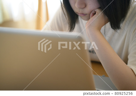 Woman using a laptop (cinematic) 80925256
