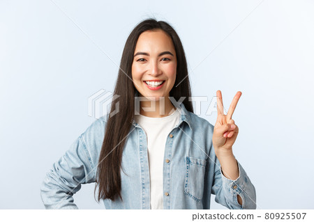 Lifestyle, people emotions and beauty concept. Cheerful cute asian girl, female student in college looking happy, show peace sign and smiling broadly, standing white background Lifestyle, people emotions and beauty concept. Cheerful cute asian girl, female student in college looking happy, show peace sign and smiling broadly, standing white background 80925507