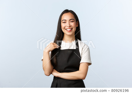 Coffee shop, small business and startup concept. Happy and friendly asian female barista in black apron smiling at client, listening to order, staff at cafe prepare drinks for customers Coffee shop, small business and startup concept. Happy and friendly asian female barista in black apron smiling at client, listening to order, staff at cafe prepare drinks for customers 80926196