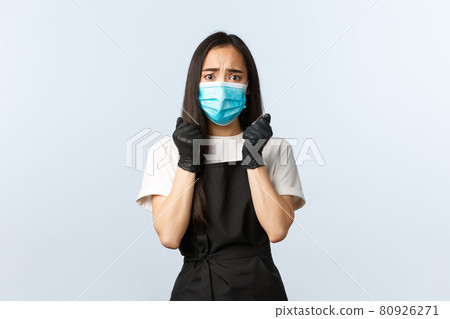 Covid-19 pandemic, social distancing, small business and preventing virus concept. Worried female asian barista scared of client coughing during coronavirus outbreak, wear medical mask and gloves Covid-19 pandemic, social distancing, small business and preventing virus concept. Worried female asian barista scared of client coughing during coronavirus outbreak, wear medical mask and gloves 80926271