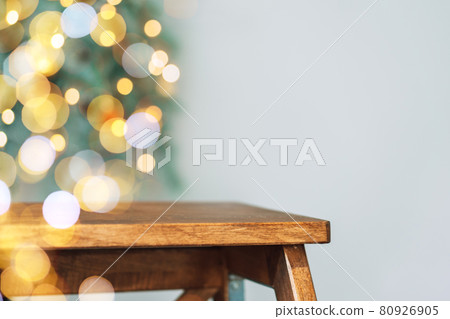 Wooden stepladder against the background of blurry christmas lights Wooden stepladder against the background of blurry christmas lights 80926905