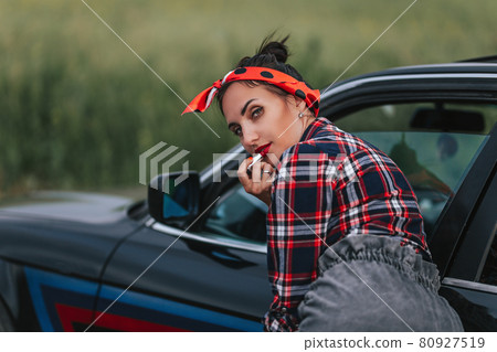Amazing young woman,outdoor portrait,fashionable model drive car 80927519