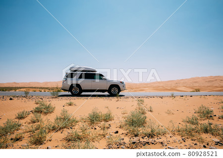 Inner Mongolia ,China, Driving White 2020 Toyota 4Runner TRD crossing in the desert road trip Inner Mongolia ,China, Driving White 2020 Toyota 4Runner TRD crossing in the desert road trip 80928521