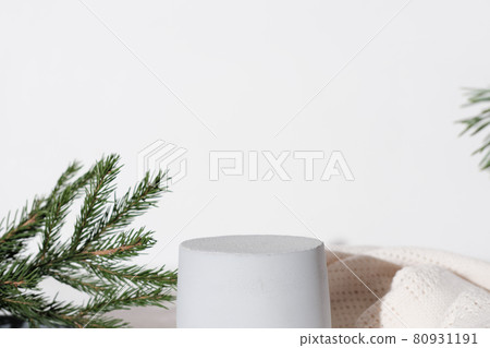 concrete or cement podium for product presentation. pedestal or display for advertizing. variety of pine branch and white scarf. Scene with geometrical forms. Empty showcase. eco friendly design. 80931191