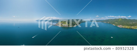 The Angara River in Siberia leaving Lake Baikal near the settlement of Listvyanka. Panoramic aerial view. 80932328