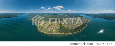 The Angara River in Siberia leaving Lake Baikal near the settlement of Listvyanka. Panoramic aerial view. The Angara River in Siberia leaving Lake Baikal near the settlement of Listvyanka. Panoramic aerial view. 80932347