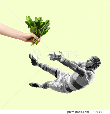 Artwork. Composition with rugby player falling and catching letuce, microgreen. Healthy lifestily, food, wellbeing concept. Artwork. Composition with rugby player falling and catching letuce, microgreen. Healthy lifestily, food, wellbeing concept. 80933199