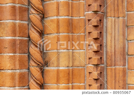 Brick work wall with ornament on old building. Red brick wall texture architecture background. Brick work wall with ornament on old building. Red brick wall texture architecture background. 80935067