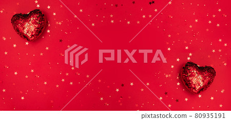 Red hearts, star shape confetti on red surface with space for text. Valentine's Day. Mother's day, wedding, women's day, Christmas, New Year. Holiday greeting card. 80935191