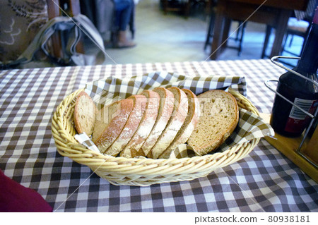 Bread placed on a tablecloth 80938181