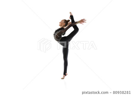 Portrait of little girl, rhythmic gymnastics artist isolated on white studio background. Concept of sport, action, aspiration, education, active lifestyle Portrait of little girl, rhythmic gymnastics artist isolated on white studio background. Concept of sport, action, aspiration, education, active lifestyle 80938281