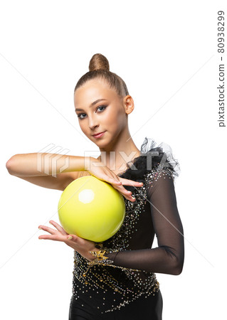 Close-up portrait of young rhythmic gymnastics artist in stage costume isolated on white studio background. Concept of sport, action, active lifestyle Close-up portrait of young rhythmic gymnastics artist in stage costume isolated on white studio background. Concept of sport, action, active lifestyle 80938299