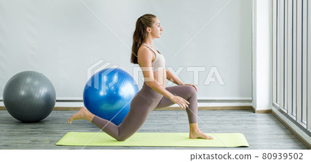 Caucasian woman exercise doing the yoga pose stretching at home, healthy lifestyle concept Caucasian woman exercise doing the yoga pose stretching at home, healthy lifestyle concept 80939502