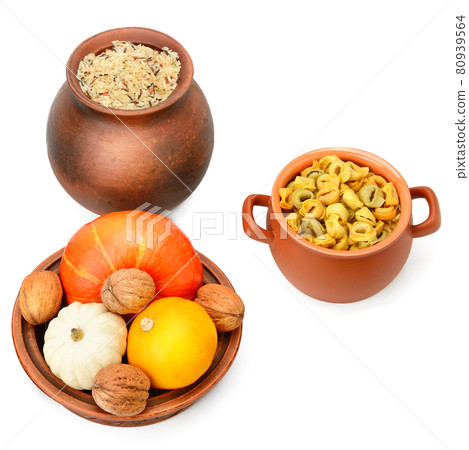 Rice, ravioli and pumpkin isolated on white background. 80939564