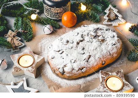 Traditional german stollen cake with Christmas decorations. Traditional german stollen cake with Christmas decorations. 80939590