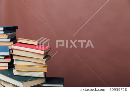 Stacks of books for teaching knowledge university library brown background Stacks of books for teaching knowledge university library brown background 80939728