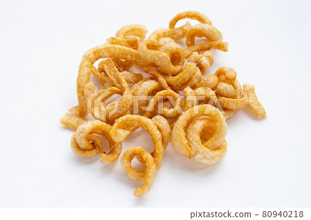 Fried crispy pork rinds on white background. Fried crispy pork rinds on white background. 80940218