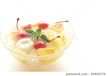 Shooting a fruit punch with various fruits and white balls on a white background Shooting a fruit punch with various fruits and white balls on a white background 80940578